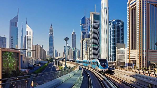 Dubai Metro train along Sheikh Zayed Road — getting around Dubai for holiday rental guests | Dubai Holiday Rentals