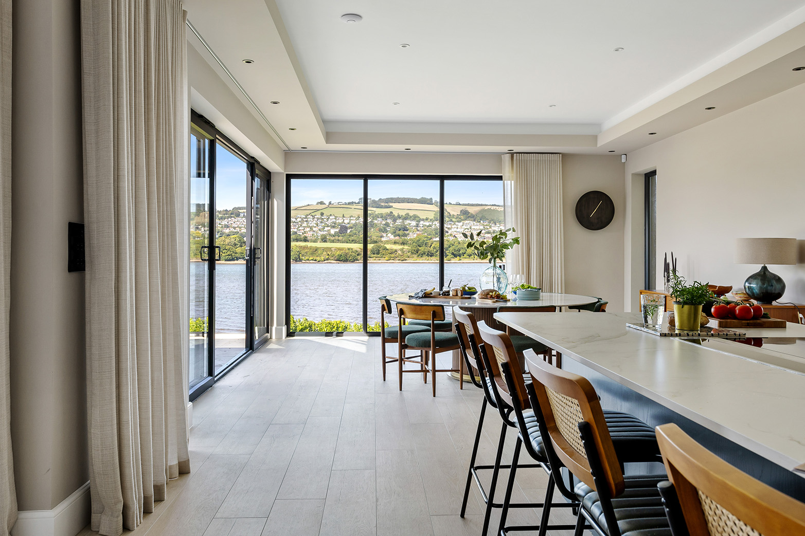 Open-plan kitchen and dining area with river view