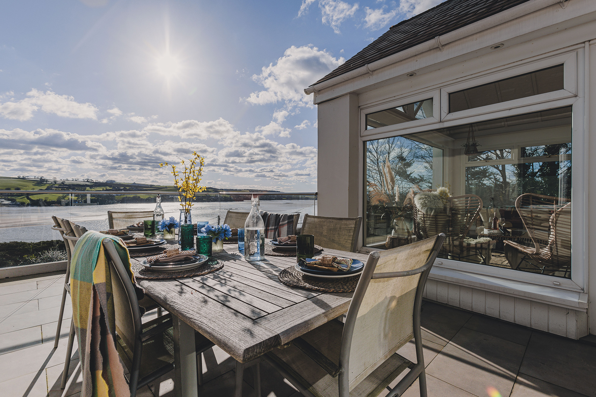 Outdoor terrace dining table overlooking the river