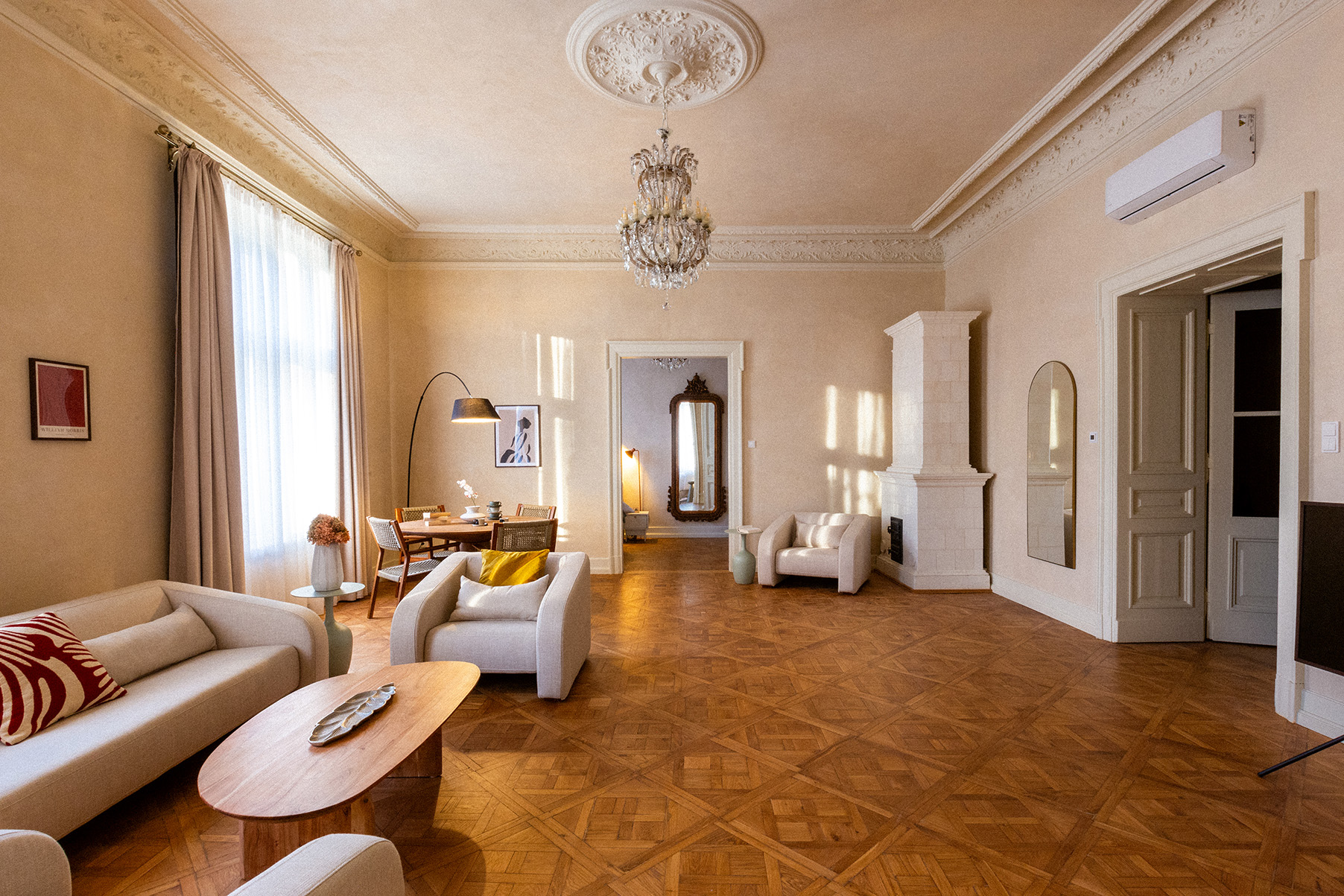 Elegant living room with crystal chandelier and parquet floors